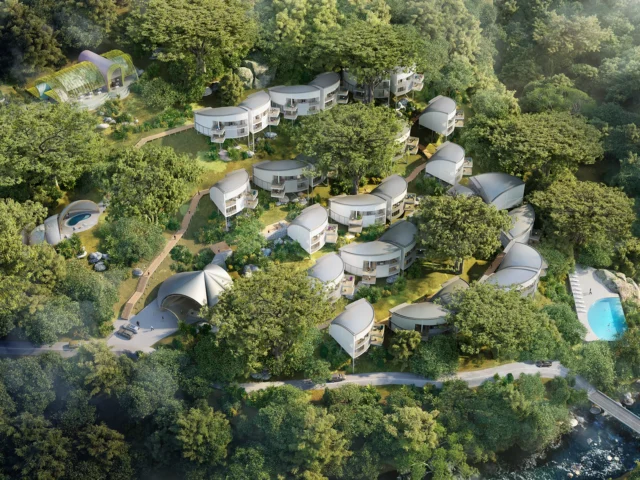 Daytime aerial view of La Vega resort with villas, spa, and restaurant set in lush forest